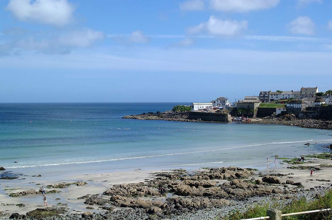 The beach at Coverack, you can hire a paddleboard locally.