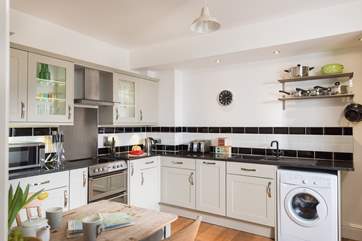 The spacious kitchen is stylish.