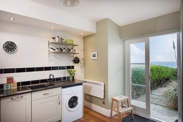 Doors open from the kitchen onto the patio terrace.
