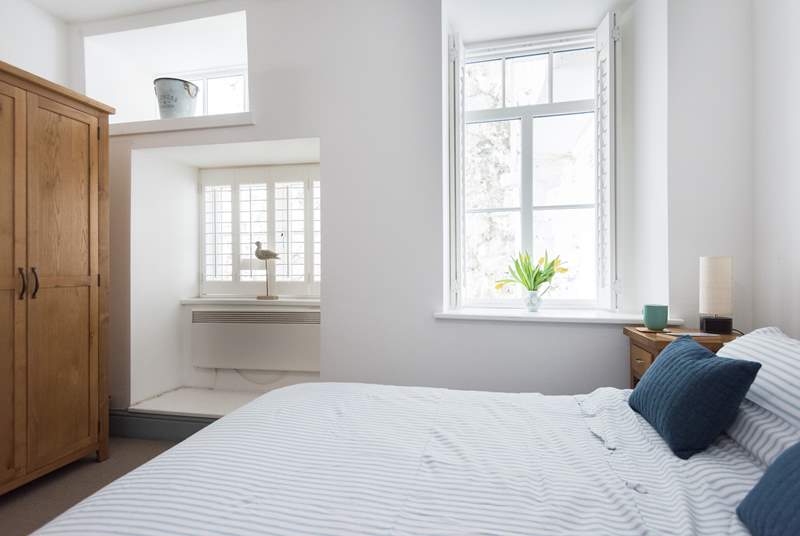 The bedrooms are to the rear of the apartment but the double-aspect windows bring in the light.