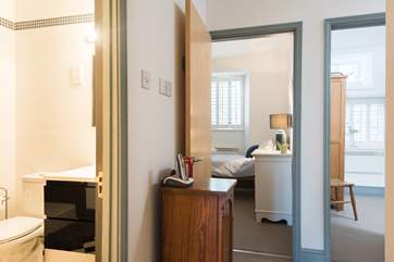 The shower-room is located between the sitting/dining-room and bedrooms.