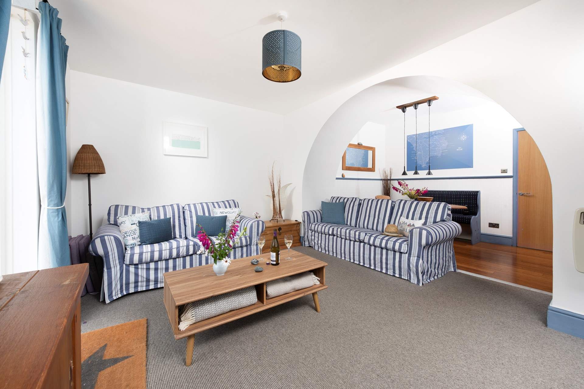 This lovely apartment in coastal hues is light and airy.