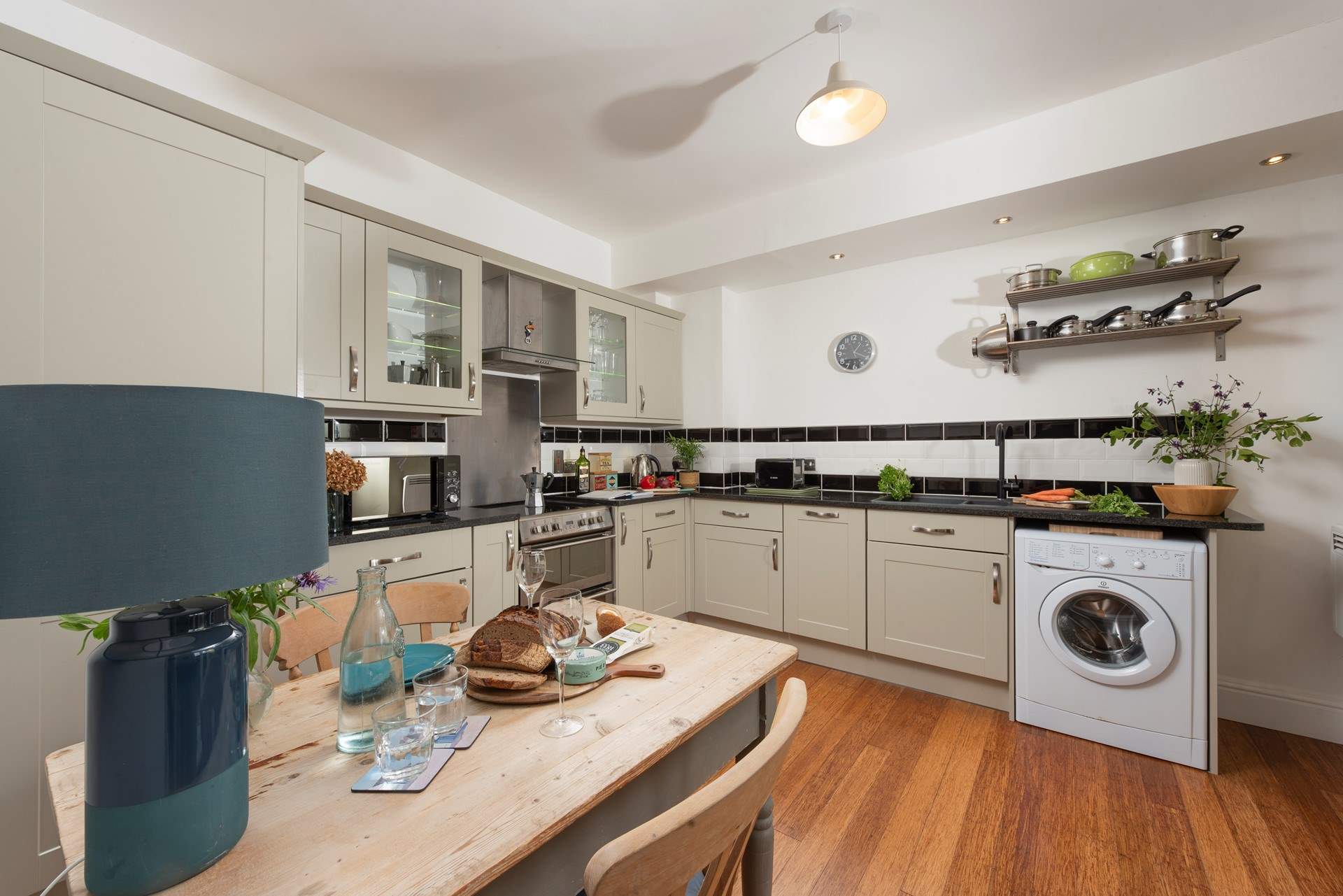 The spacious kitchen is stylish.