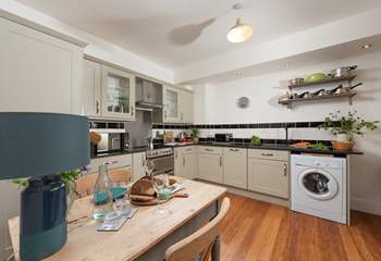 The spacious kitchen is stylish.