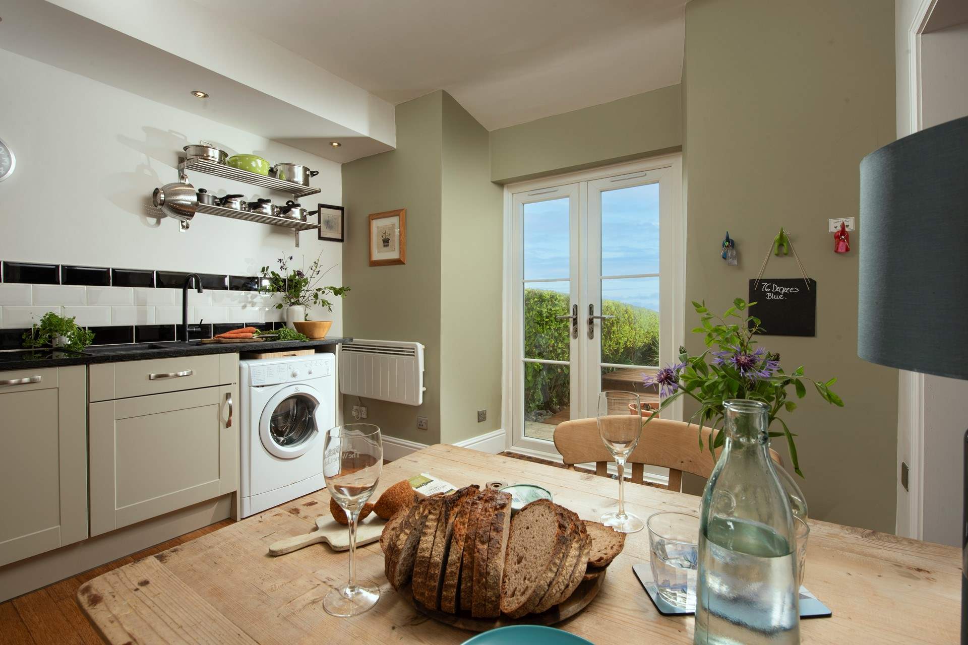 Doors open from the kitchen onto the terrace.