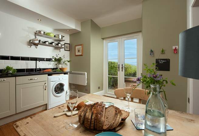 Doors open from the kitchen onto the terrace.