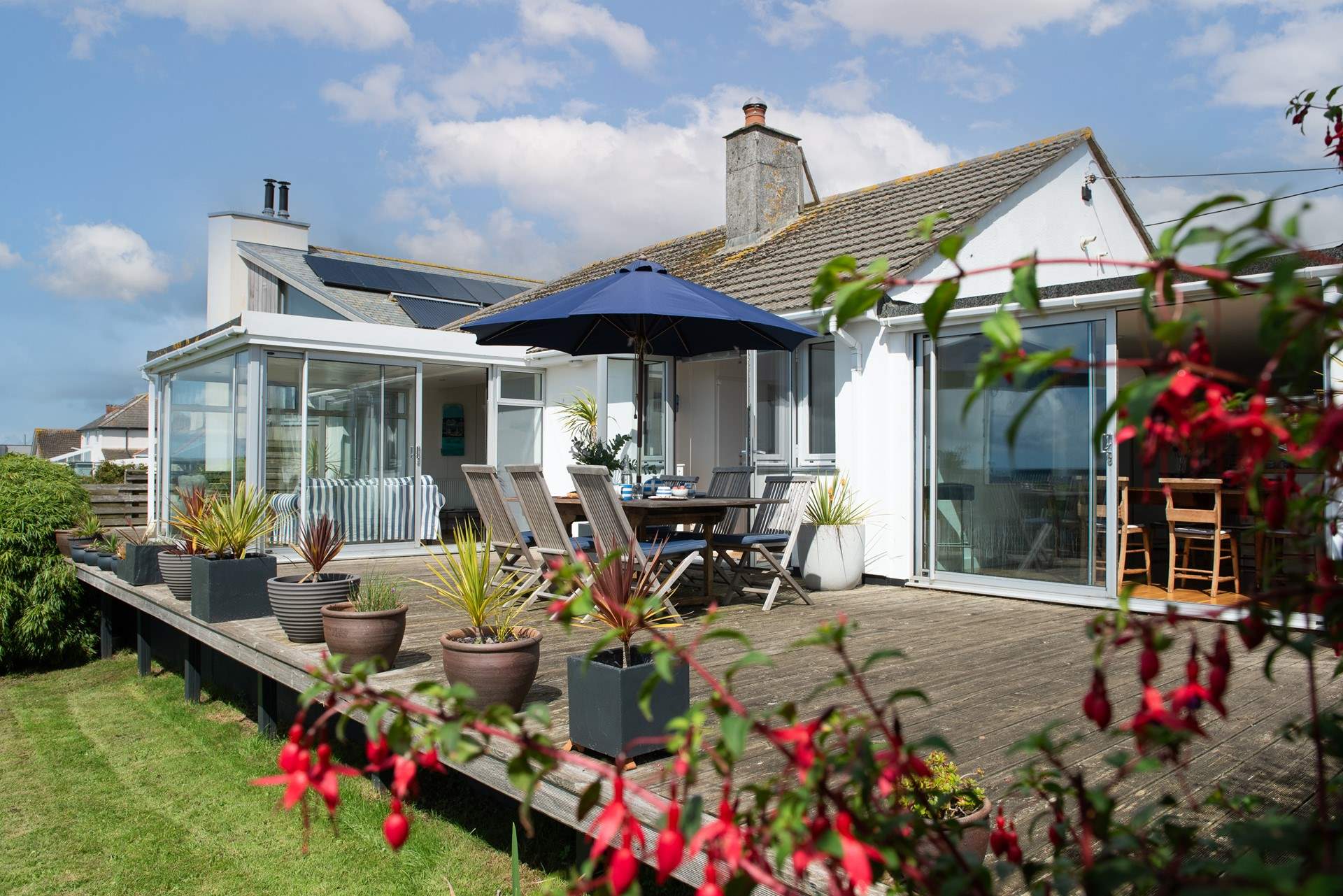 The decked area leads onto the garden. Please take care as you step down onto the lawn. 