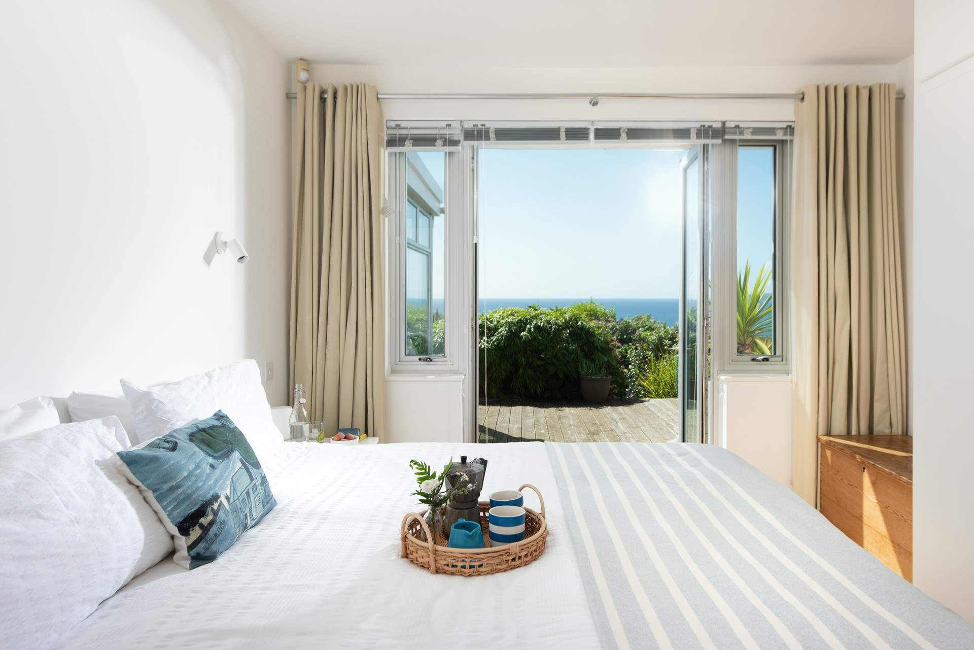 Bedroom 1 leads out onto the decked terrace. 