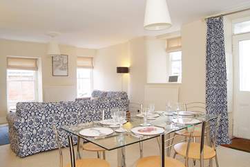 The sitting/dining-room is unexpectedly light and spacious for a Cornish cottage.