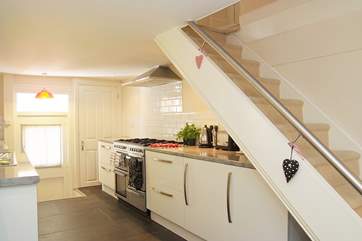 The galley kitchen is fully equipped. The cottage stairs are not too narrow or steep but there is only a small rail, so please take care with children.