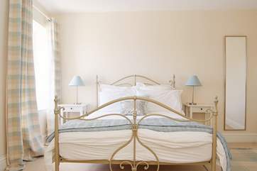 The comfortable double bed in Bedroom 1.