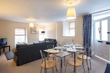 The sitting/dining-room is unexpectedly light and spacious for a Cornish cottage.