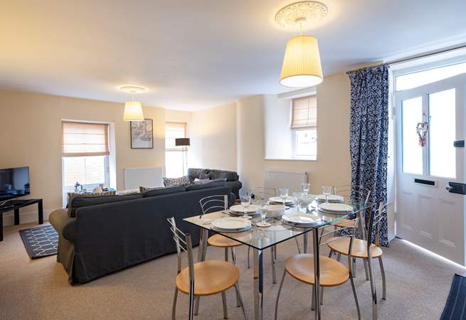 The sitting/dining-room is unexpectedly light and spacious for a Cornish cottage.