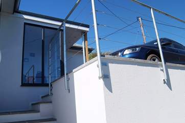 The parking-area in front of the cottage has space for up to three cars. Take care with small children as there is a drop on one side.