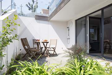 Step out of bedroom 4 on to your own private patio and outside shower for those warmer days. There are also steps up the the main decking area.
