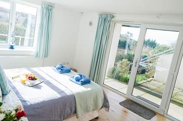 Bedroom 4 is on the lower ground and benefits from its own patio-area. This room also has a single bed option and is situated next to a large shower-room.