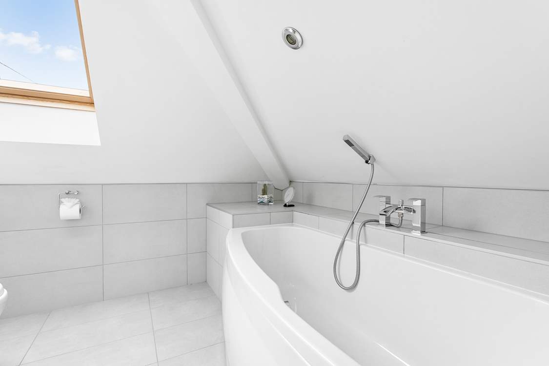 The en suite bathroom to Bedroom 2 - take care on the low lintel and reduced head room.