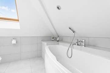 The en suite bathroom to Bedroom 2 - take care on the low lintel and reduced head room.