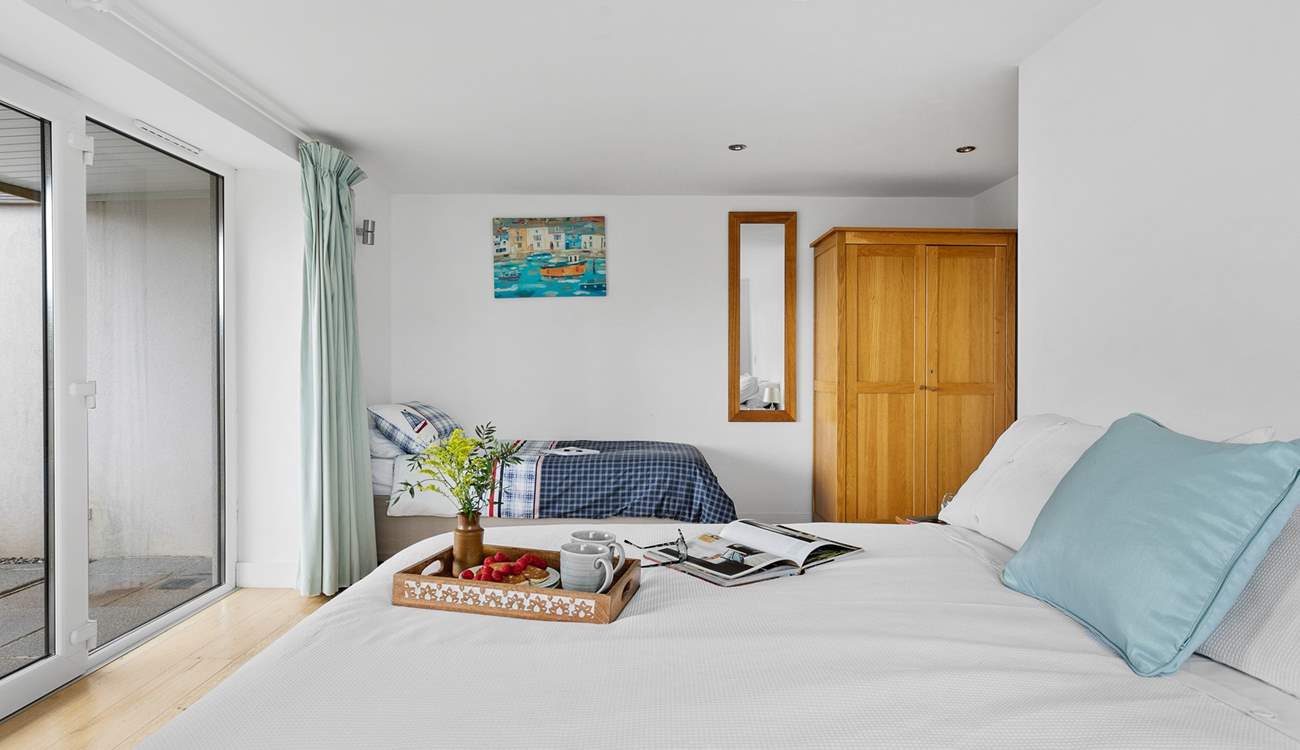 Bedroom 4 is on the lower ground and benefits from its own patio-area.  This room also has a single bed option and is situated next to a large wet-room.