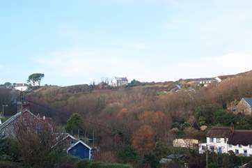 Sea View enjoys an enviable position (centre of photo) within walking distance of the village and pub, it's downhill all the way there!