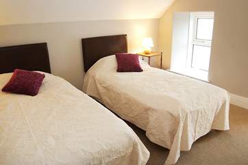 Two of the single beds in the loft room can be joined to make a king-size double bed.