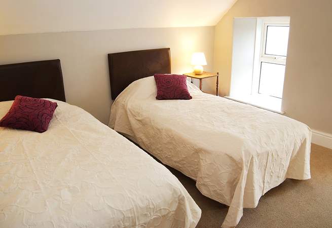 Two of the single beds in the loft room can be joined to make a king-size double bed.