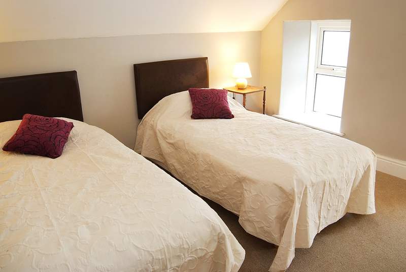Two of the single beds in the loft room can be joined to make a king-size double bed.