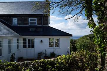 As you approach the house from the parking-area you will catch the sea view beyond.