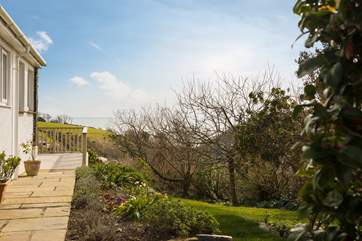 Looking down the side of the cottage the decking wraps around to make the most of this stunning location.