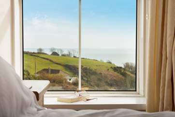 The view from the first floor double bedroom window can be seen from the bed, who needs a book or magazine.