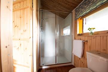 Your own en suite double shower, WC and wash-basin inside the tent!