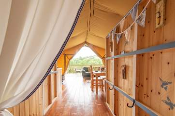 Looking back through, past the cabin bed, to the living area and deck beyond.