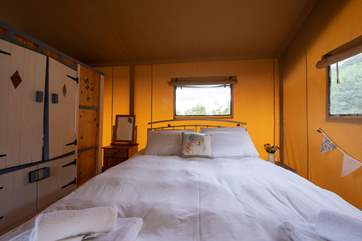 A comfy bed, perfect for retiring to after a fun day of exploring.