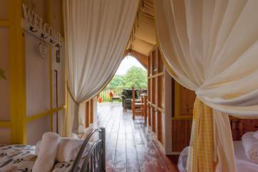 Looking through the tent from the twin bedroom to the living-area and deck beyond.