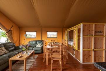 Looking towards the sitting and dining-areas with the double cabin bed too.