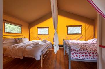 A lovely handmade curtain divides the two bedrooms.