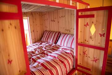 The den bed has doors on both sides and plenty of storage space underneath.