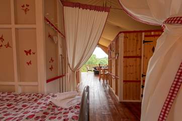 Looking through the tent from the twin bedroom to the living-area and deck beyond.