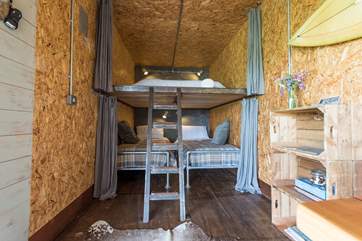 The bedroom-area has luxury linens and proper sprung mattresses and privacy curtains.