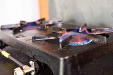 A double gas hob for cooking to supplement the log-fired stove.