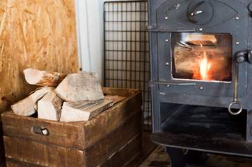 Logs are included for the log-fired stove.