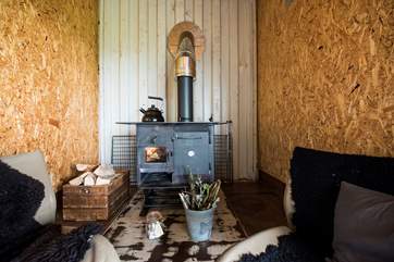 The cosy sitting-area with log-fired range to keep you toasty and warm in the cooler months (and your cooker too!).