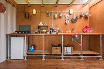 The kitchen is light and spacious with plenty of preparation space for picnic grub and barbecue bits (and hundreds of marshmallows for the fire-pit).