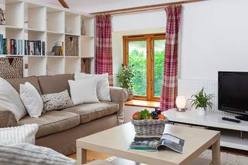 Lovely natural light pours in from the windows, bringing the outside very much in!