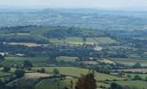 Somerset is a beautifully varied county. This view across the levels, with Glastonbury Tor in the distance, is taken from a vantage picnic point at the top of the Mendips. - Thumbnail Image