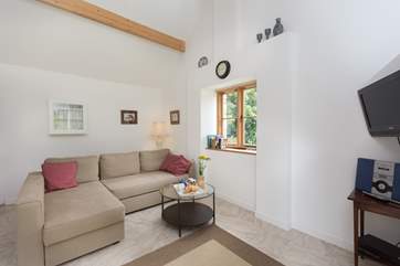 The L-shaped sofas create a relaxing area in the room.