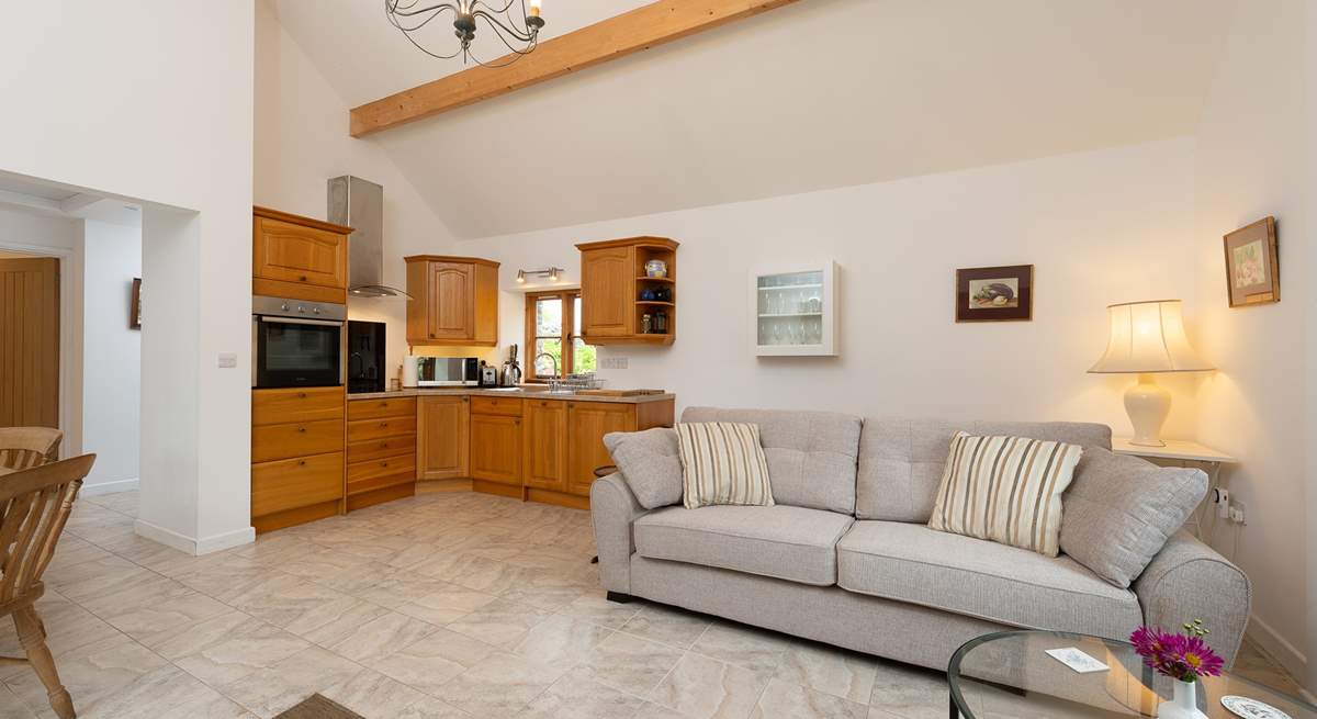 Ashey Barn has a spacious open plan living area, with the kitchen in one corner.