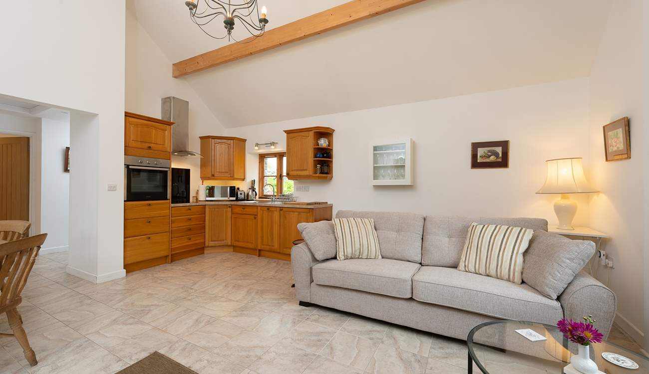 Ashey Barn has a spacious open plan living area, with the kitchen in one corner.