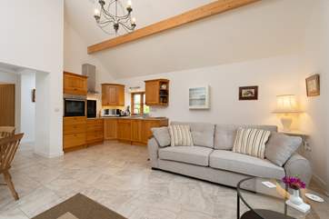 Ashey Barn has a spacious open plan living area, with the kitchen in one corner.