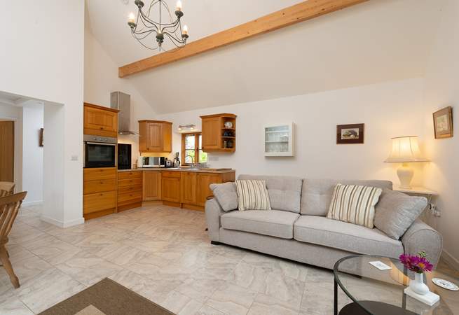 Ashey Barn has a spacious open plan living area, with the kitchen in one corner.